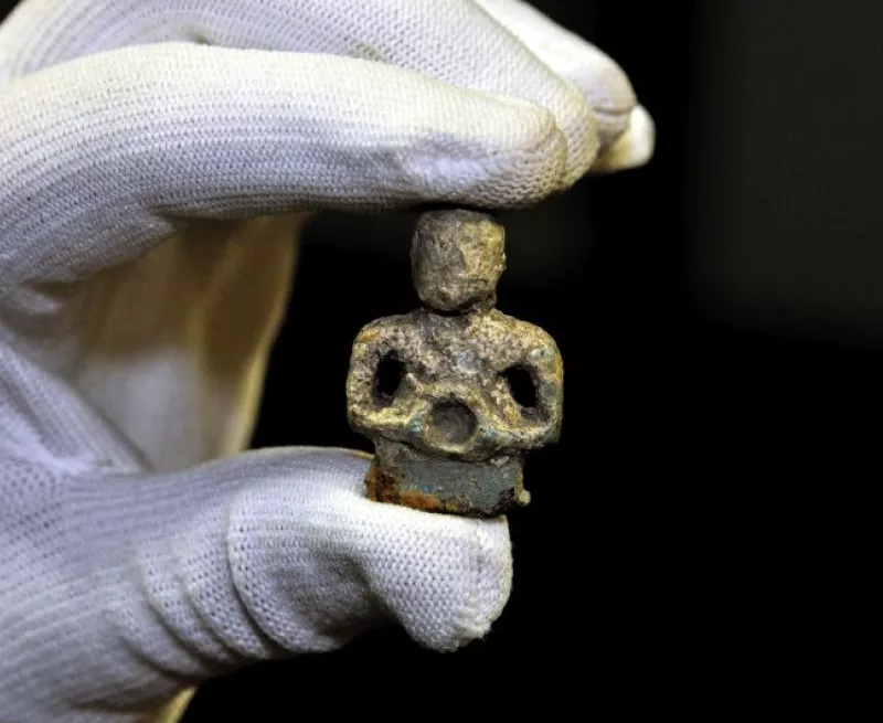 Copper alloy figurine, possibly of Celtic deity, from Wimpole Hall, Cambridgeshire